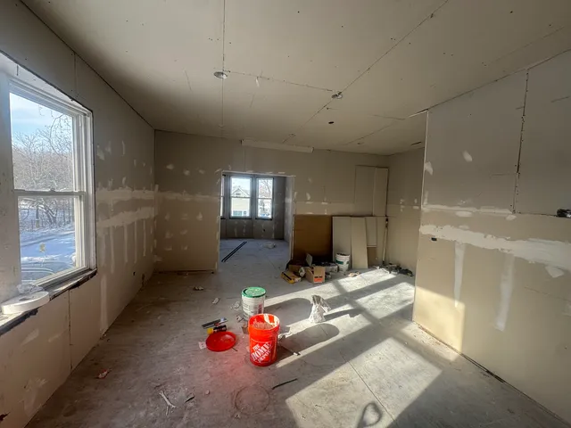 a living room with furniture and a table