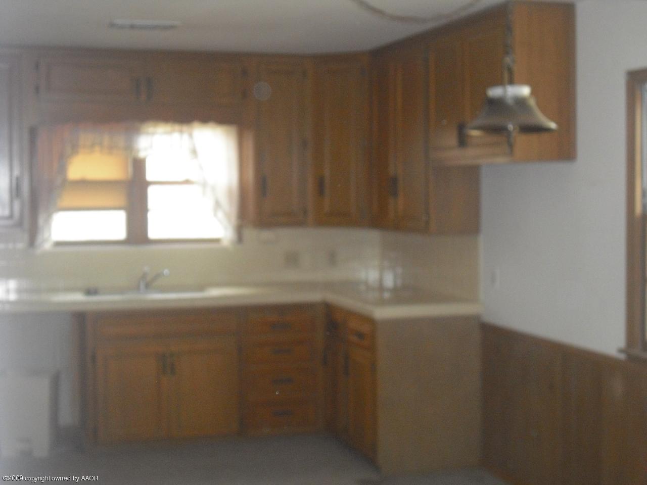 5009 Arden Road Amarillo, TX 79110 - Photo 13 of 18 a close view of sink and cabinets