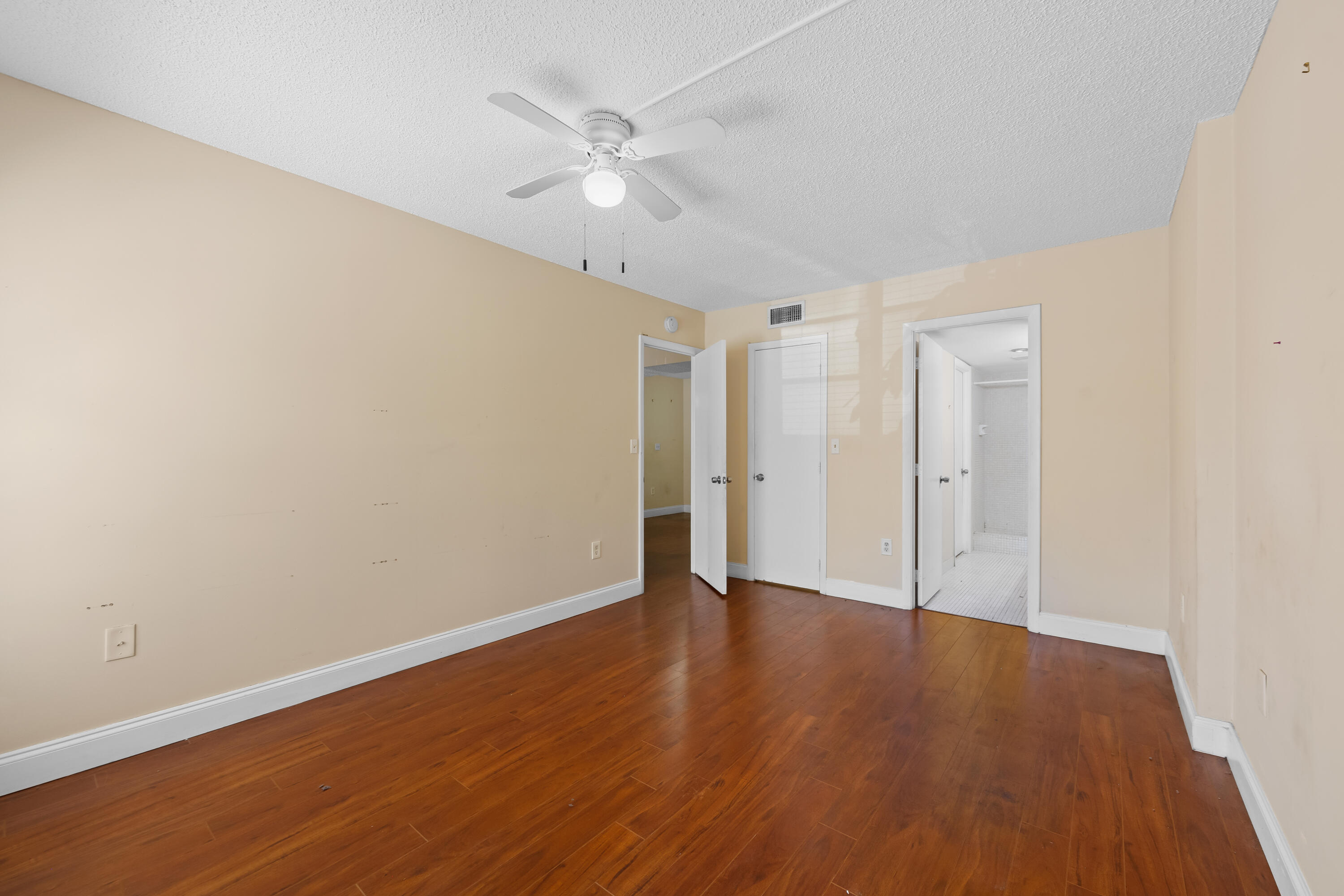 4156 Inverrary Drive, Unit 210 Lauderhill, FL 33319 - Photo 9 of 27 a view of an empty room with wooden floor