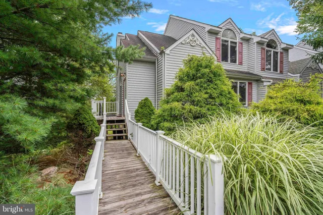 a view of a house with a yard and plants