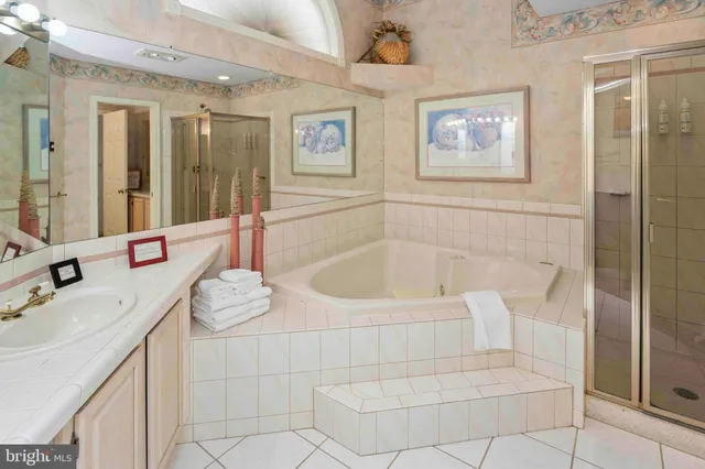 a bathroom with a bathtub and a shower