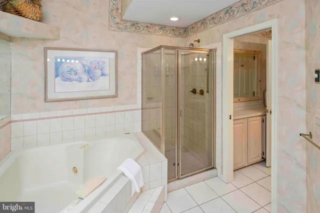 a bedroom with furniture and a mirror