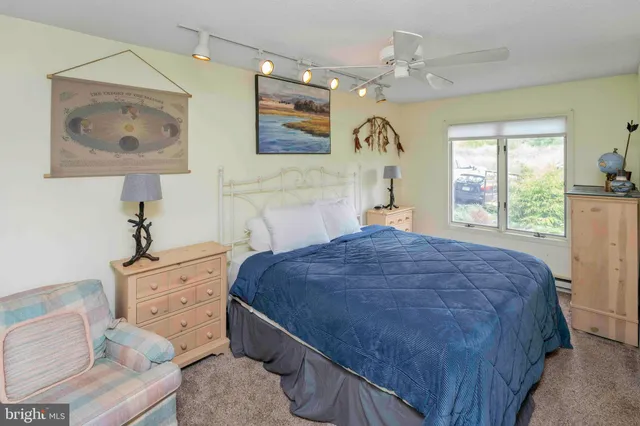 a view of a hallway with workspace and stairs