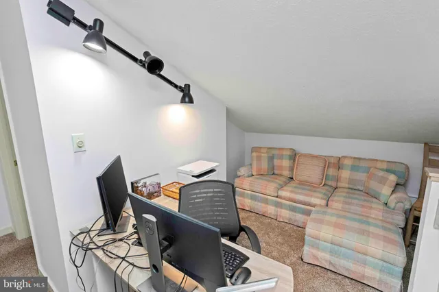 a view of entryway with livingroom