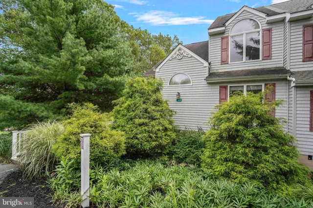 a view of a house with a door and a window