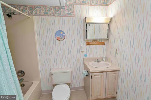 a bedroom with a bed and a table