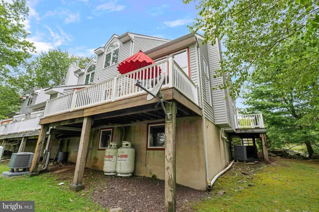 a balcony with trees in front of it