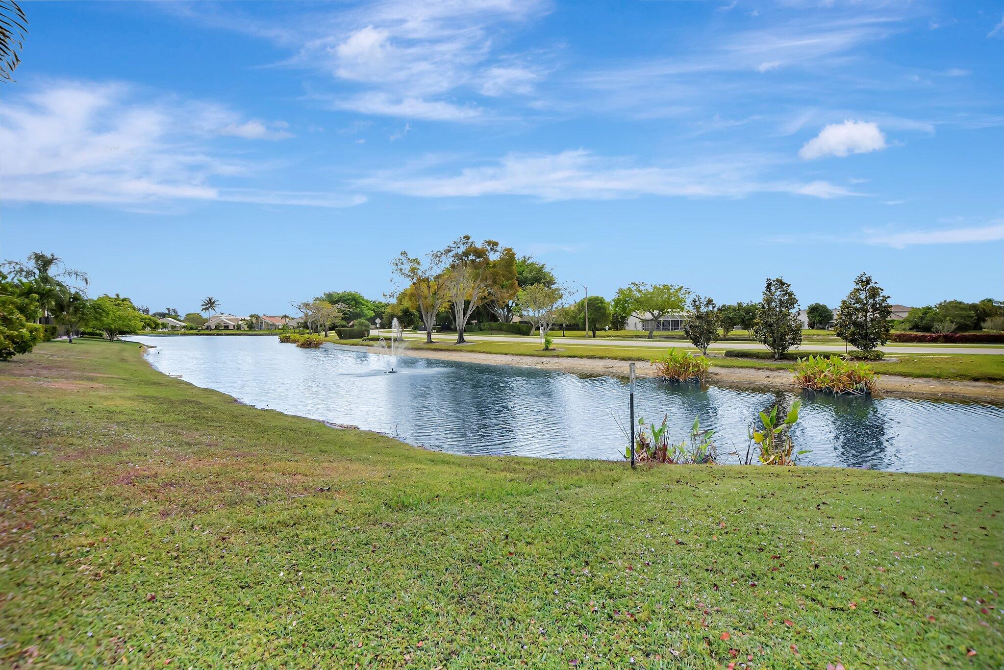 18498 East Covington Trace Boca Raton, FL 33498 - Photo 47 of 62 a view of a lake with a big yard