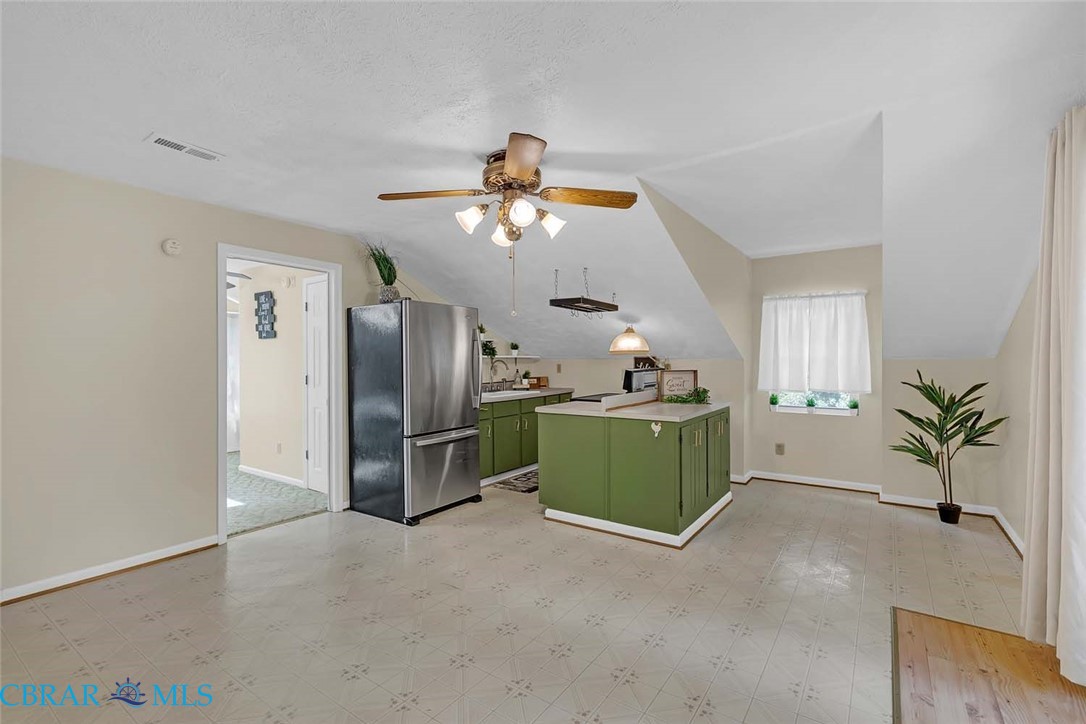 423 Kings Landing Road Onemo, VA 23130 - Photo 29 of 63 a living room with furniture and a chandelier
