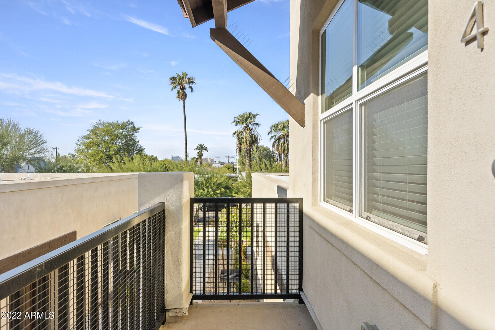 2245 North Dayton Street, Unit 4 Phoenix, AZ 85006 - Photo 3 of 28 a view of a balcony with wooden floor