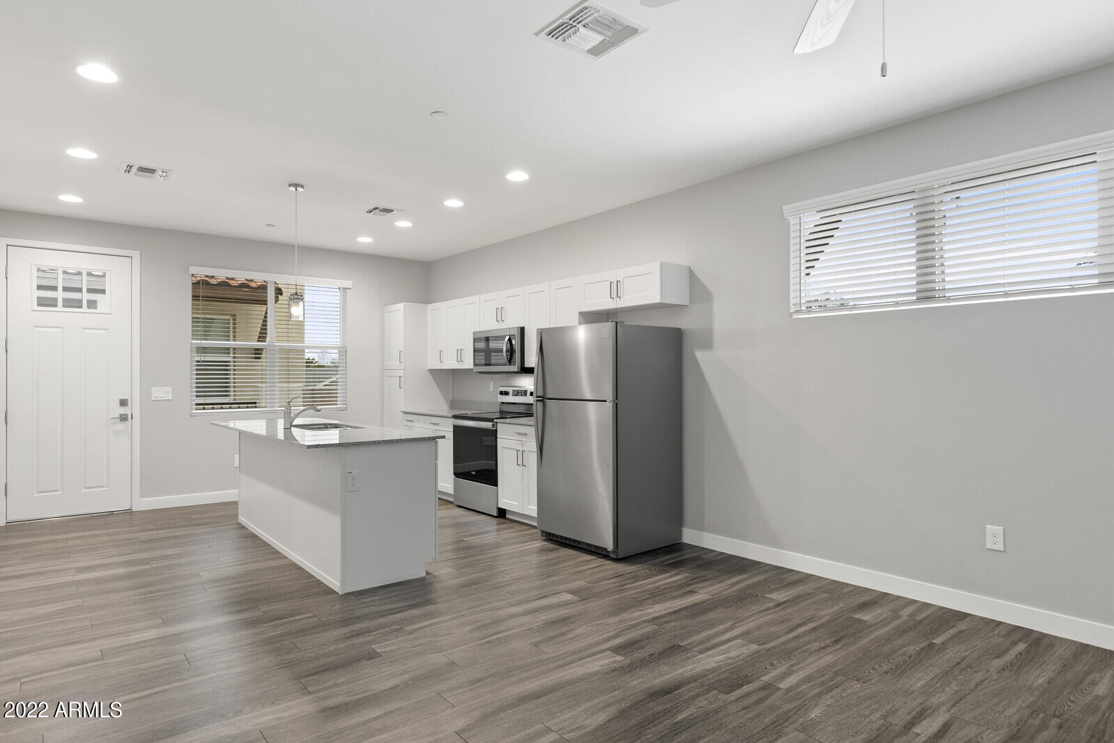 2245 North Dayton Street, Unit 4 Phoenix, AZ 85006 - Photo 6 of 28 a kitchen with stainless steel appliances granite countertop a refrigerator and a stove top oven