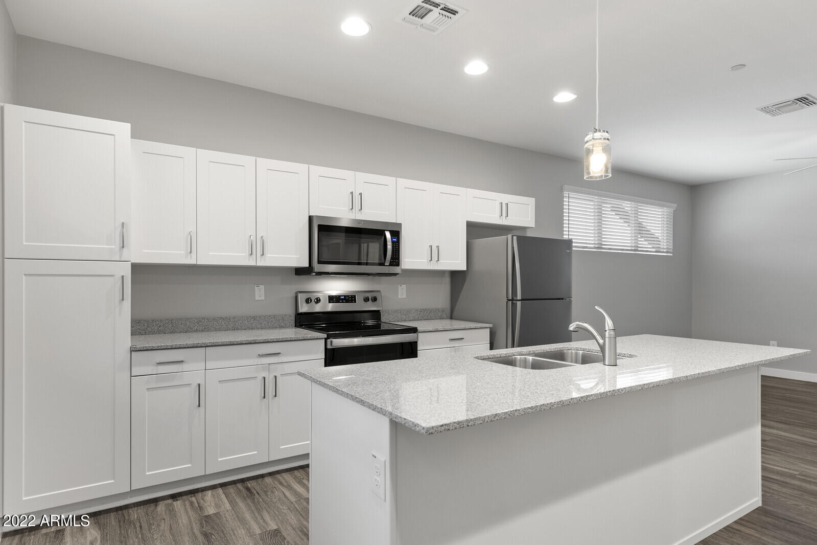 2245 North Dayton Street, Unit 4 Phoenix, AZ 85006 - Photo 7 of 28 a kitchen with stainless steel appliances a sink a stove a microwave and cabinets