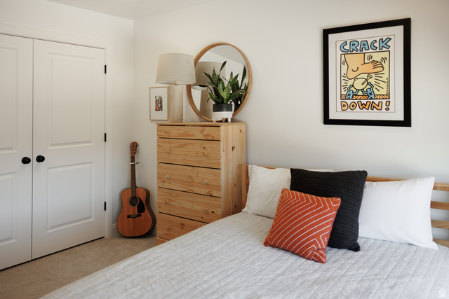 629 Spring Lily Drive St. George, UT 84790 - Photo 33 of 50 Light-toned wood-finish bed frame with a white quilted spread