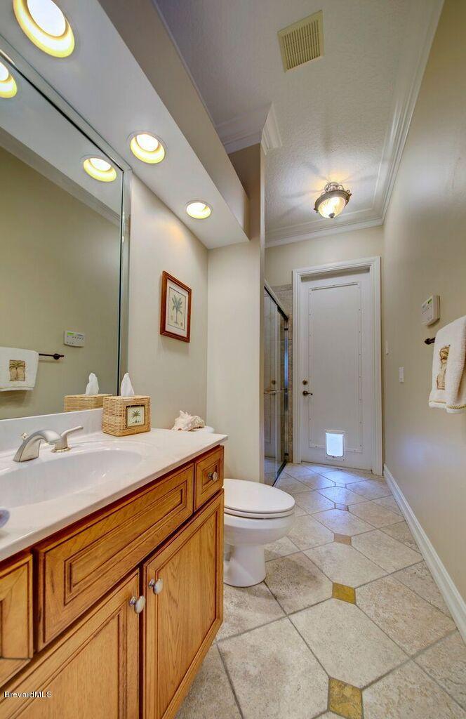 3955 Harlock Road Melbourne, FL 32934 - Photo 32 of 63 Pool area bathroom