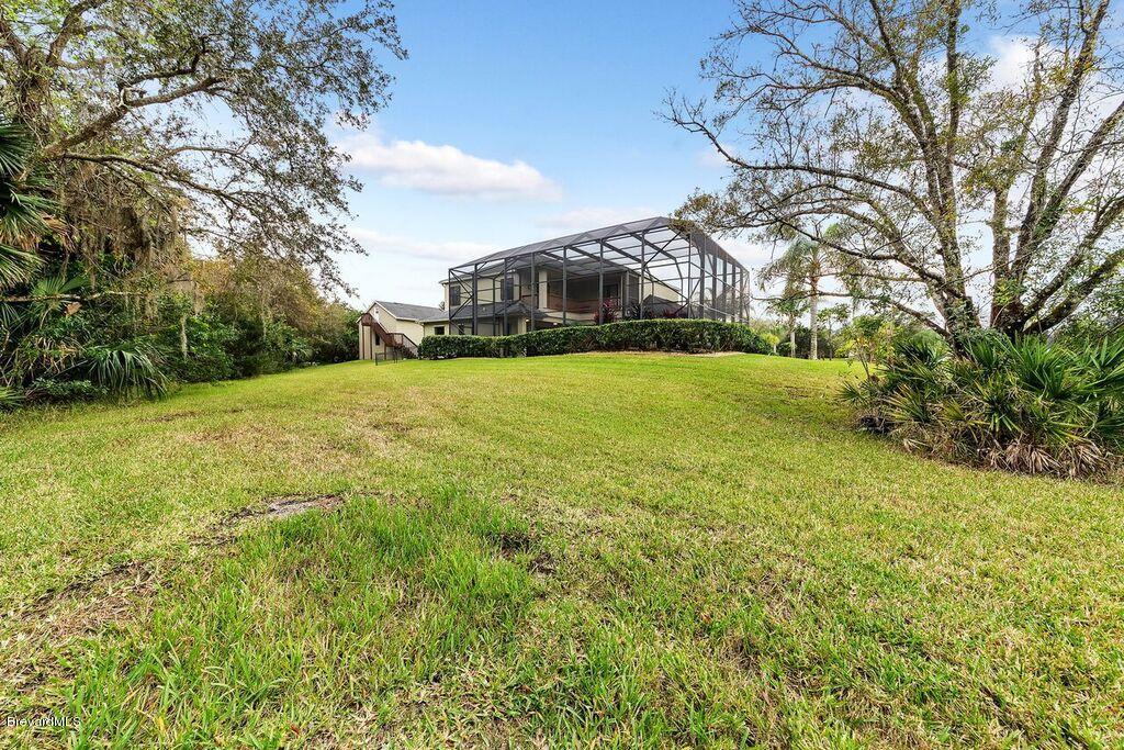 3955 Harlock Road Melbourne, FL 32934 - Photo 60 of 63 Pool and property view