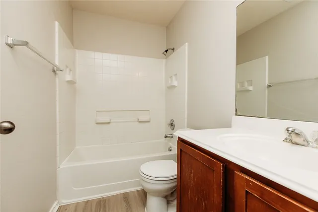 a bathroom with a sink a toilet and a bathtub
