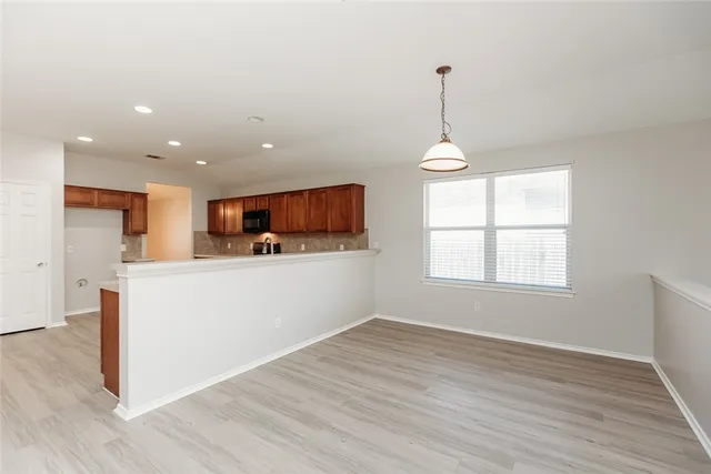 a room with window and wooden floor