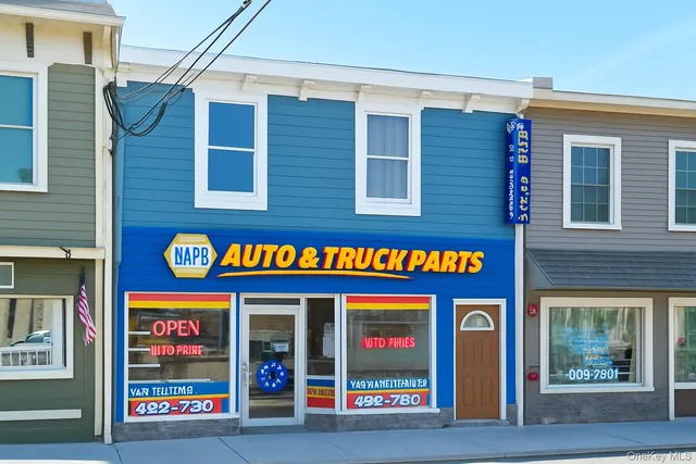 a bunch of street signs outside the stores