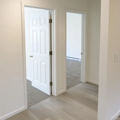 an empty room with wooden floor