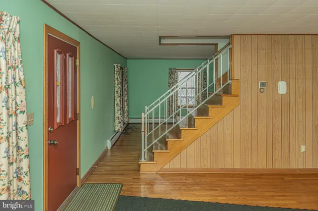 a view of entryway with wooden floor