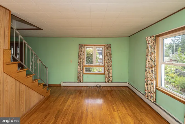 a kitchen with a stove a sink and a refrigerator
