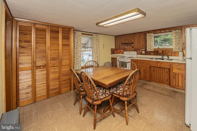 a view of a dining room with furniture window and outside view