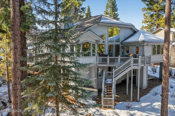 a front view of a house with yard