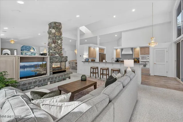 a large white kitchen with a large window