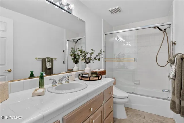 a bedroom with bed and window