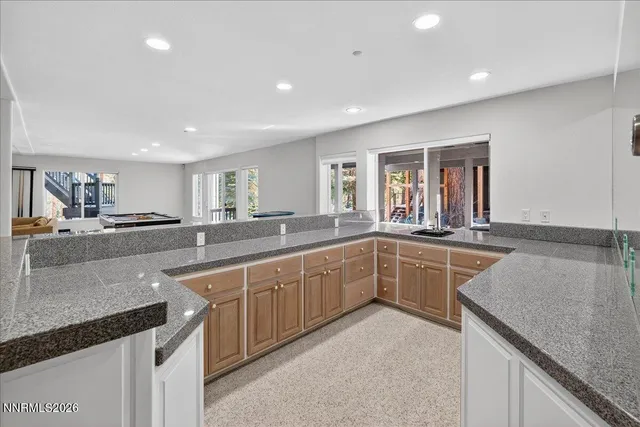 a bathroom with a sink vanity and a toilet