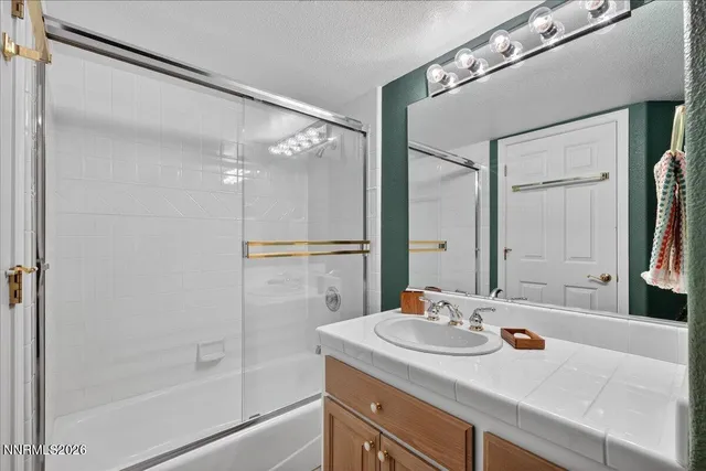 a work room with furniture and a flat screen tv