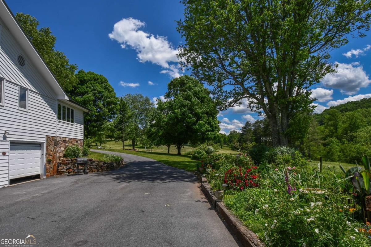 708 Hub Tatum Road Sautee Nacoochee, GA 30571 - Photo 15 of 100 a view of a house with a yard and garden