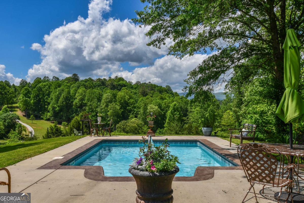 708 Hub Tatum Road Sautee Nacoochee, GA 30571 - Photo 17 of 100 a view of a fountain in the yard next to a yard