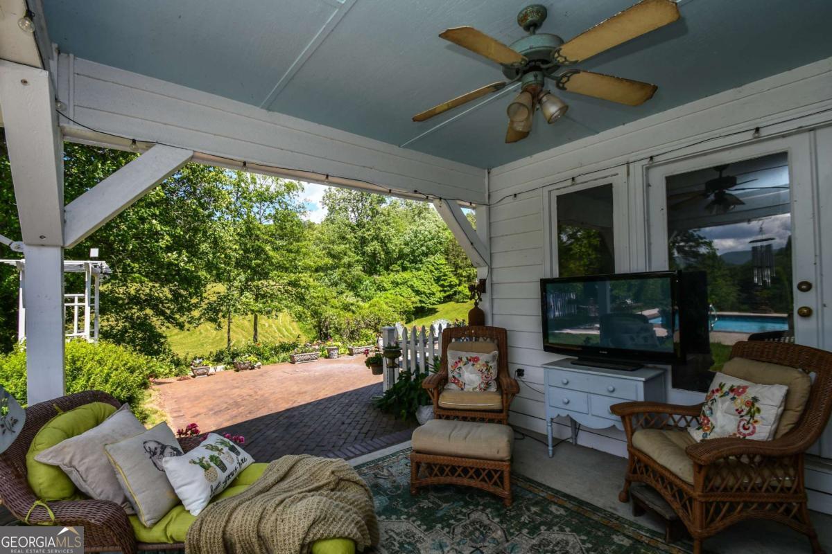 708 Hub Tatum Road Sautee Nacoochee, GA 30571 - Photo 22 of 100 a outdoor living space with furniture potted plant and a large window