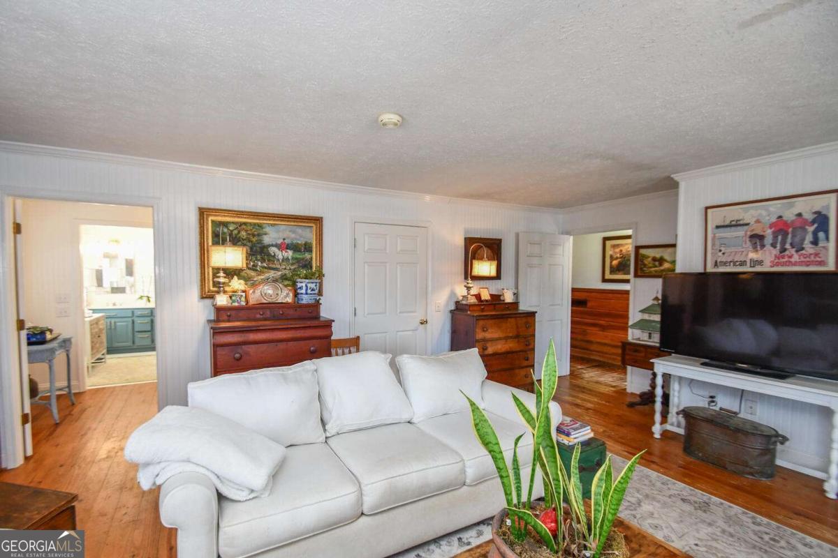 708 Hub Tatum Road Sautee Nacoochee, GA 30571 - Photo 37 of 100 a living room with furniture and a flat screen tv