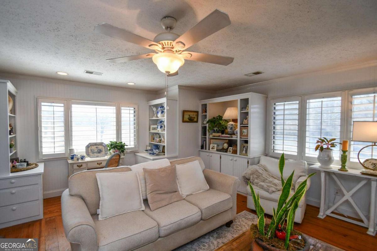 708 Hub Tatum Road Sautee Nacoochee, GA 30571 - Photo 40 of 100 a living room with furniture potted plant and a large window