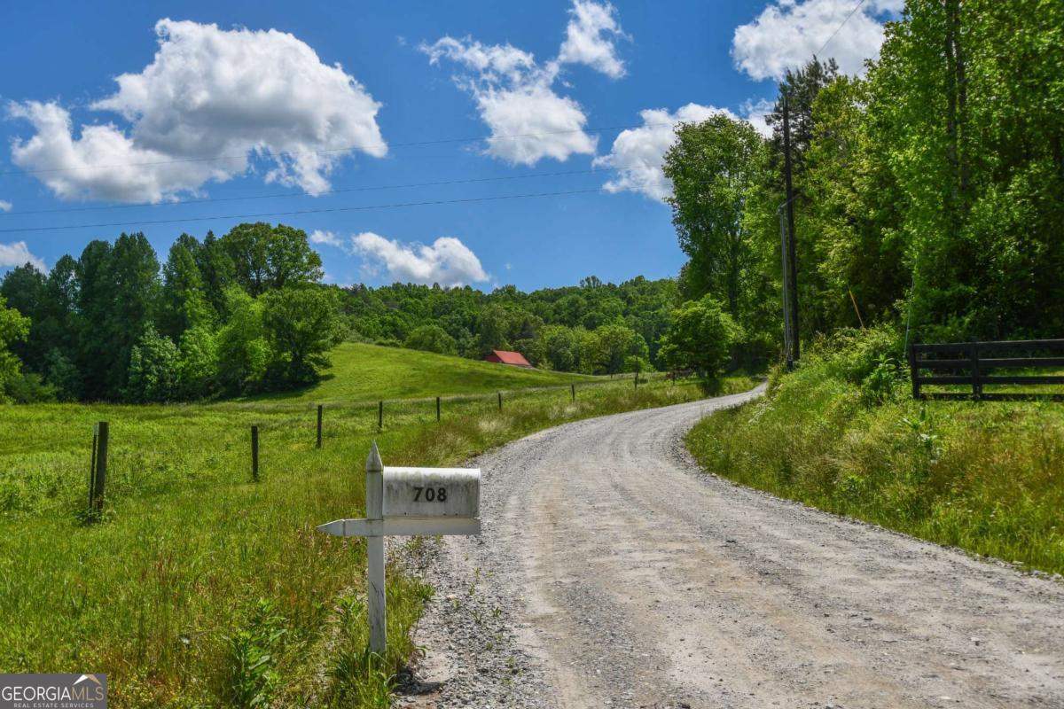 708 Hub Tatum Road Sautee Nacoochee, GA 30571 - Photo 4 of 100 a view of a golf course with a lake