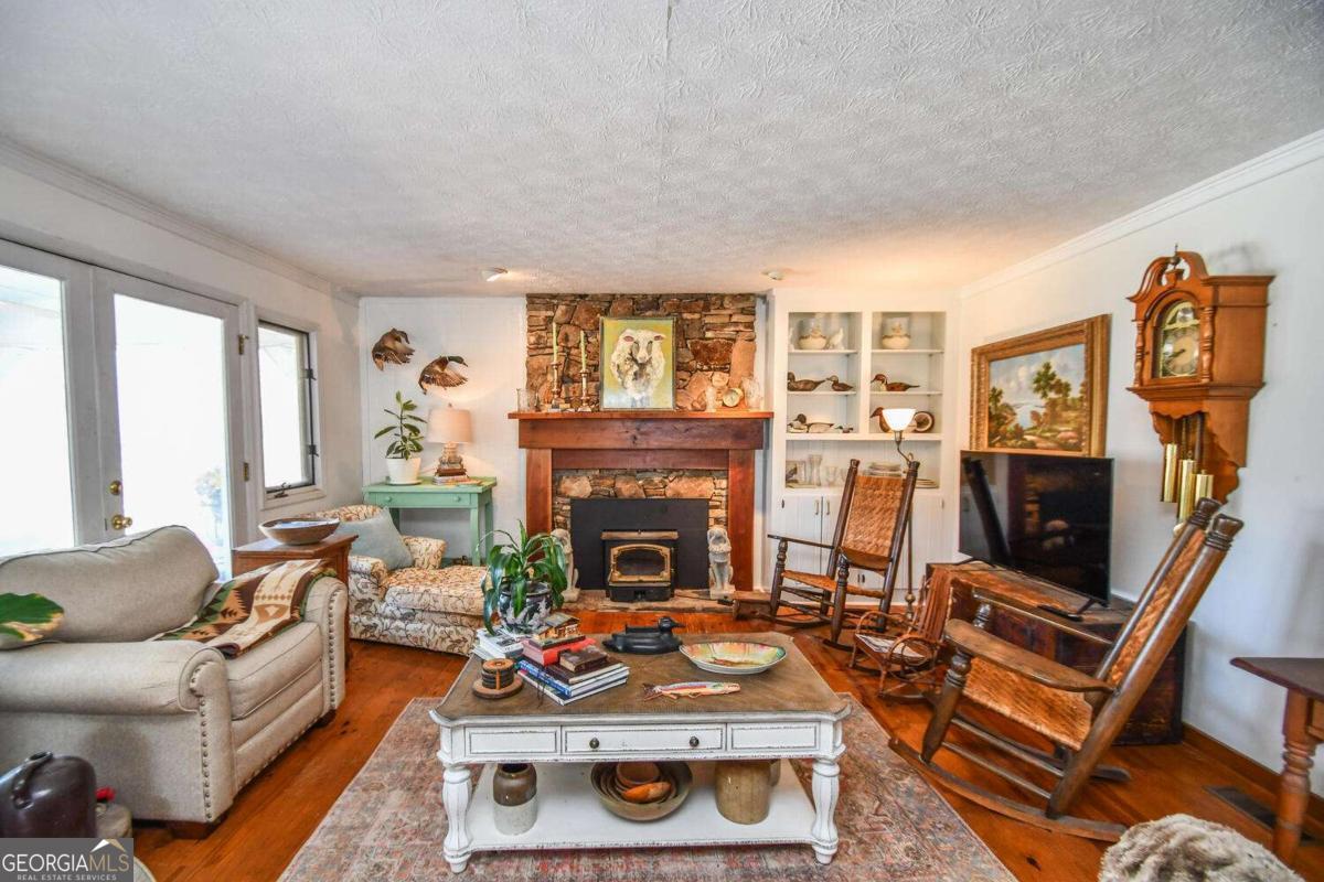 708 Hub Tatum Road Sautee Nacoochee, GA 30571 - Photo 45 of 100 a living room with furniture and a fireplace