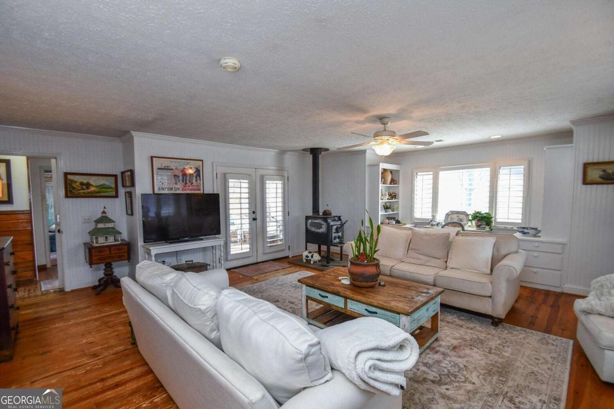 708 Hub Tatum Road Sautee Nacoochee, GA 30571 - Photo 46 of 100 a living room with furniture and a flat screen tv