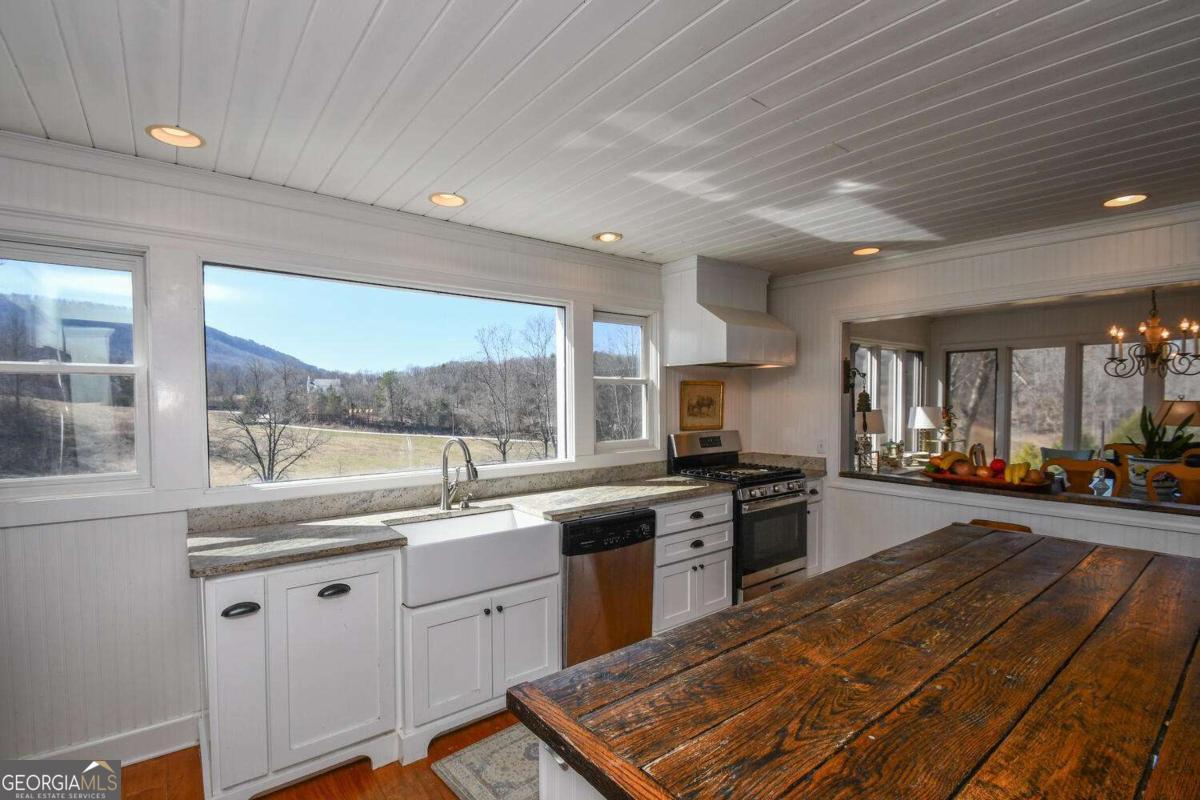 708 Hub Tatum Road Sautee Nacoochee, GA 30571 - Photo 52 of 100 a kitchen with stainless steel appliances granite countertop a stove and a sink