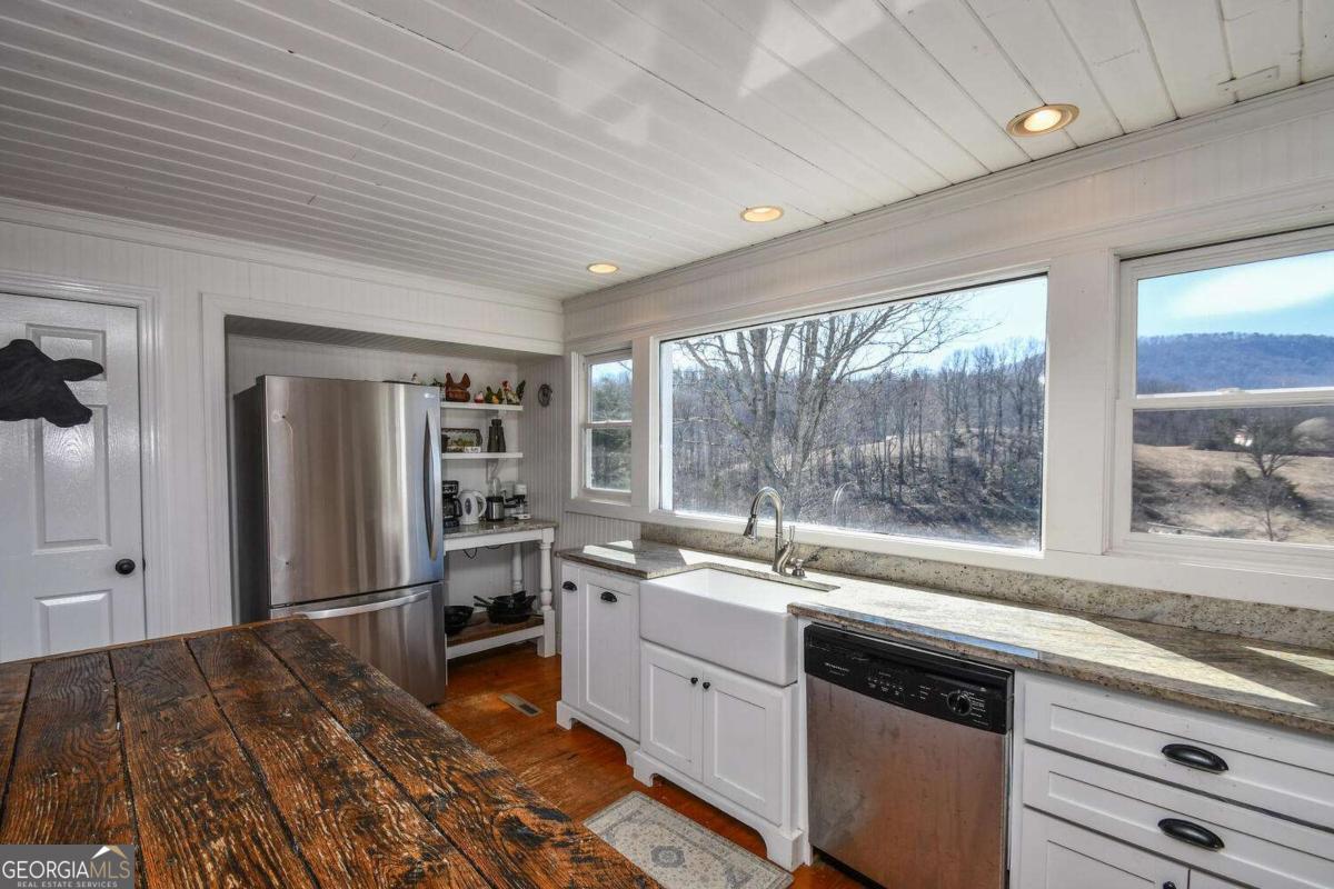 708 Hub Tatum Road Sautee Nacoochee, GA 30571 - Photo 56 of 100 a kitchen with a sink stove and refrigerator