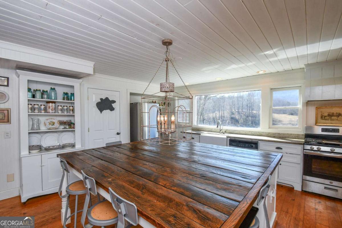 708 Hub Tatum Road Sautee Nacoochee, GA 30571 - Photo 59 of 100 a kitchen with a stove and wooden floor