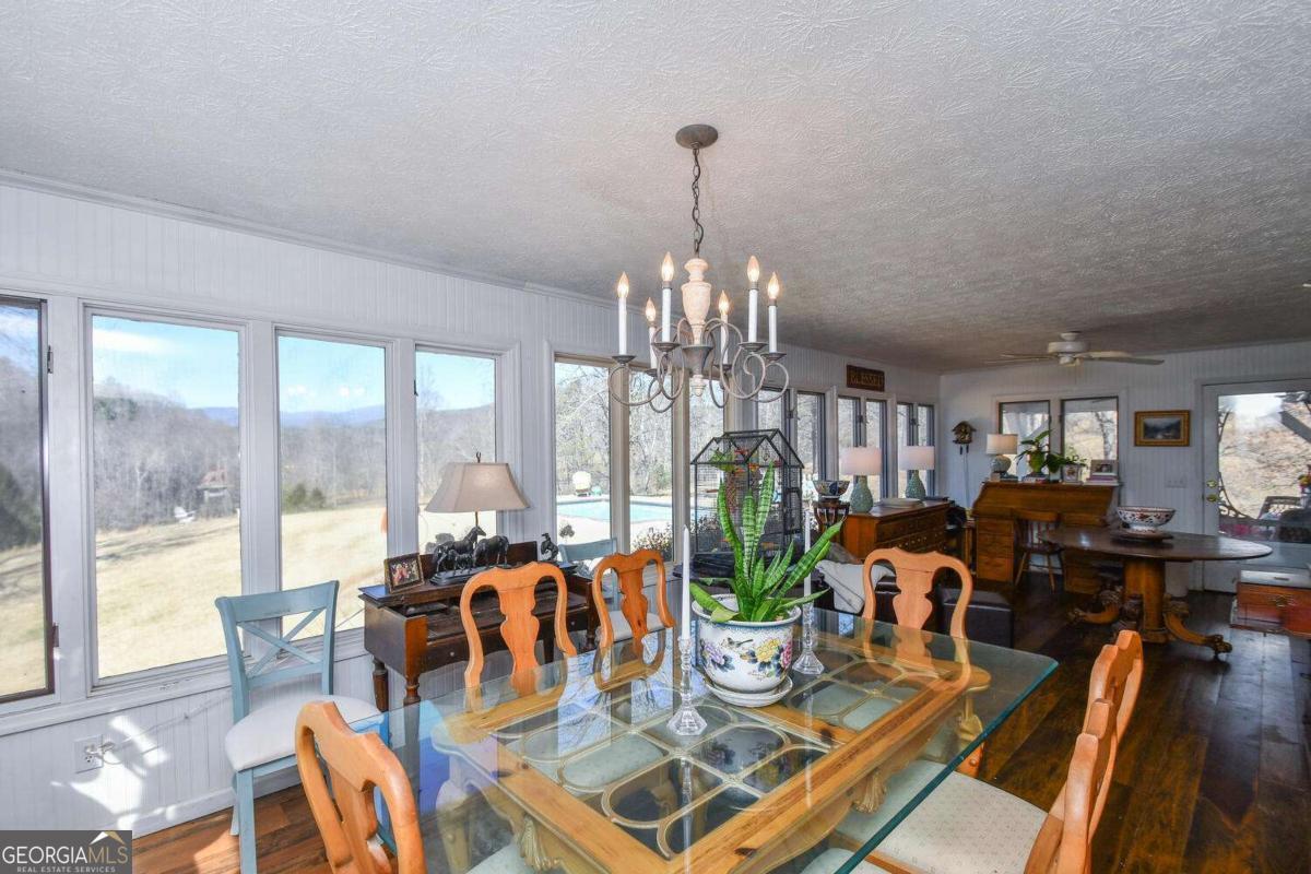 708 Hub Tatum Road Sautee Nacoochee, GA 30571 - Photo 62 of 100 a view of a dining room with furniture window and outside view