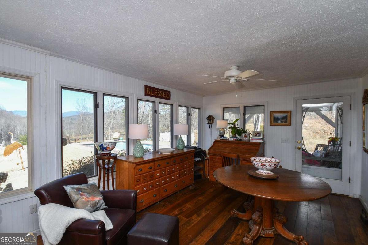 708 Hub Tatum Road Sautee Nacoochee, GA 30571 - Photo 65 of 100 a living room with furniture and large windows