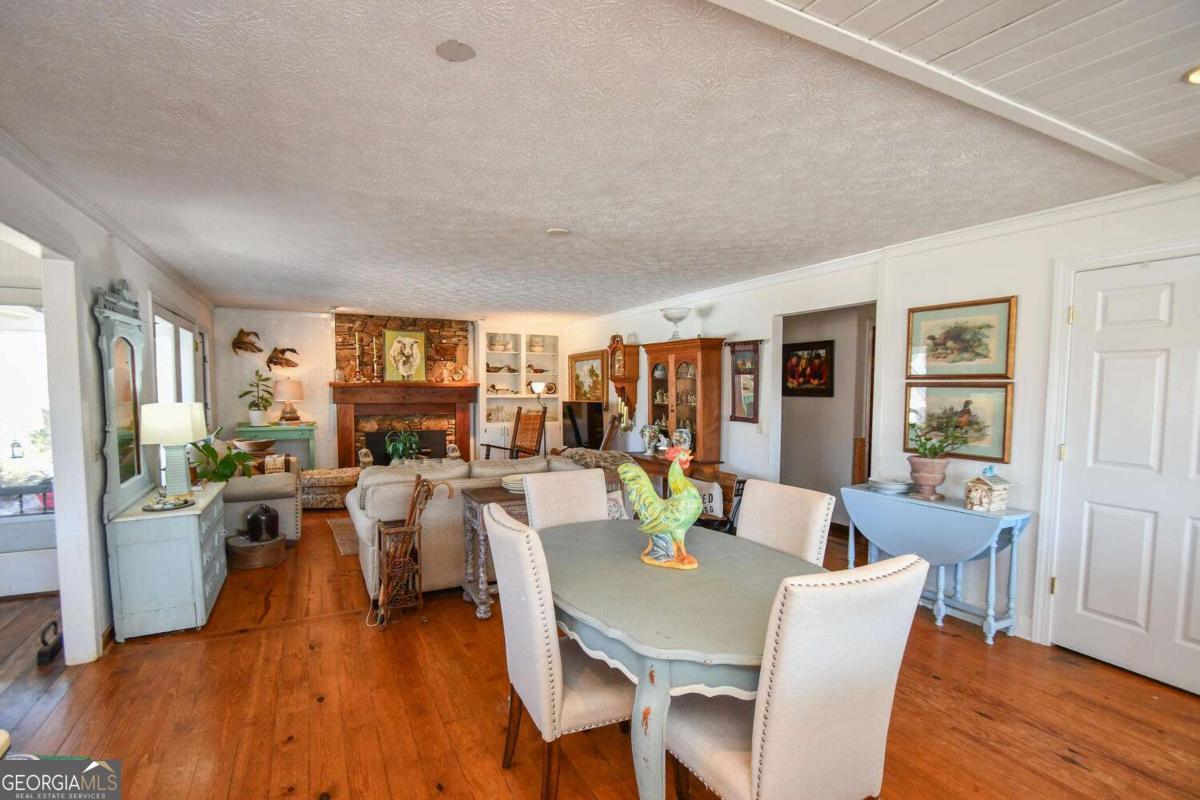 708 Hub Tatum Road Sautee Nacoochee, GA 30571 - Photo 69 of 100 a view of a dining room with furniture window and wooden floor