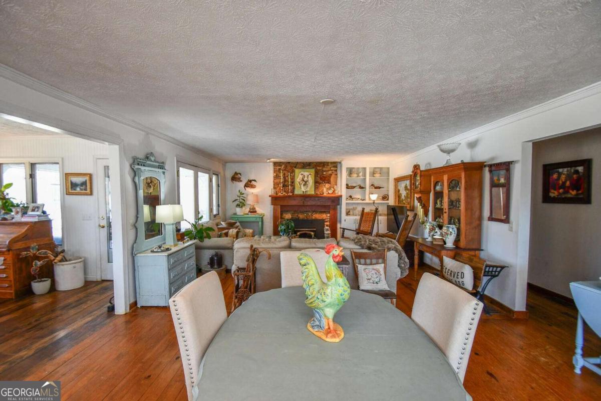 708 Hub Tatum Road Sautee Nacoochee, GA 30571 - Photo 70 of 100 a living room with furniture kitchen view and a large window