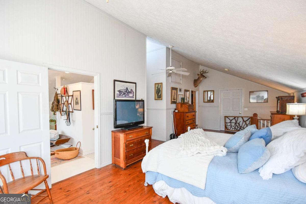 708 Hub Tatum Road Sautee Nacoochee, GA 30571 - Photo 80 of 100 a bedroom with a bed and a couch