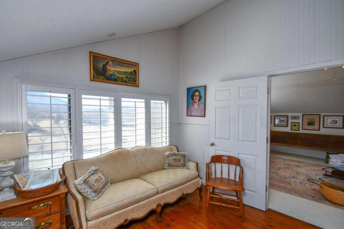 708 Hub Tatum Road Sautee Nacoochee, GA 30571 - Photo 86 of 100 a living room with furniture and a window