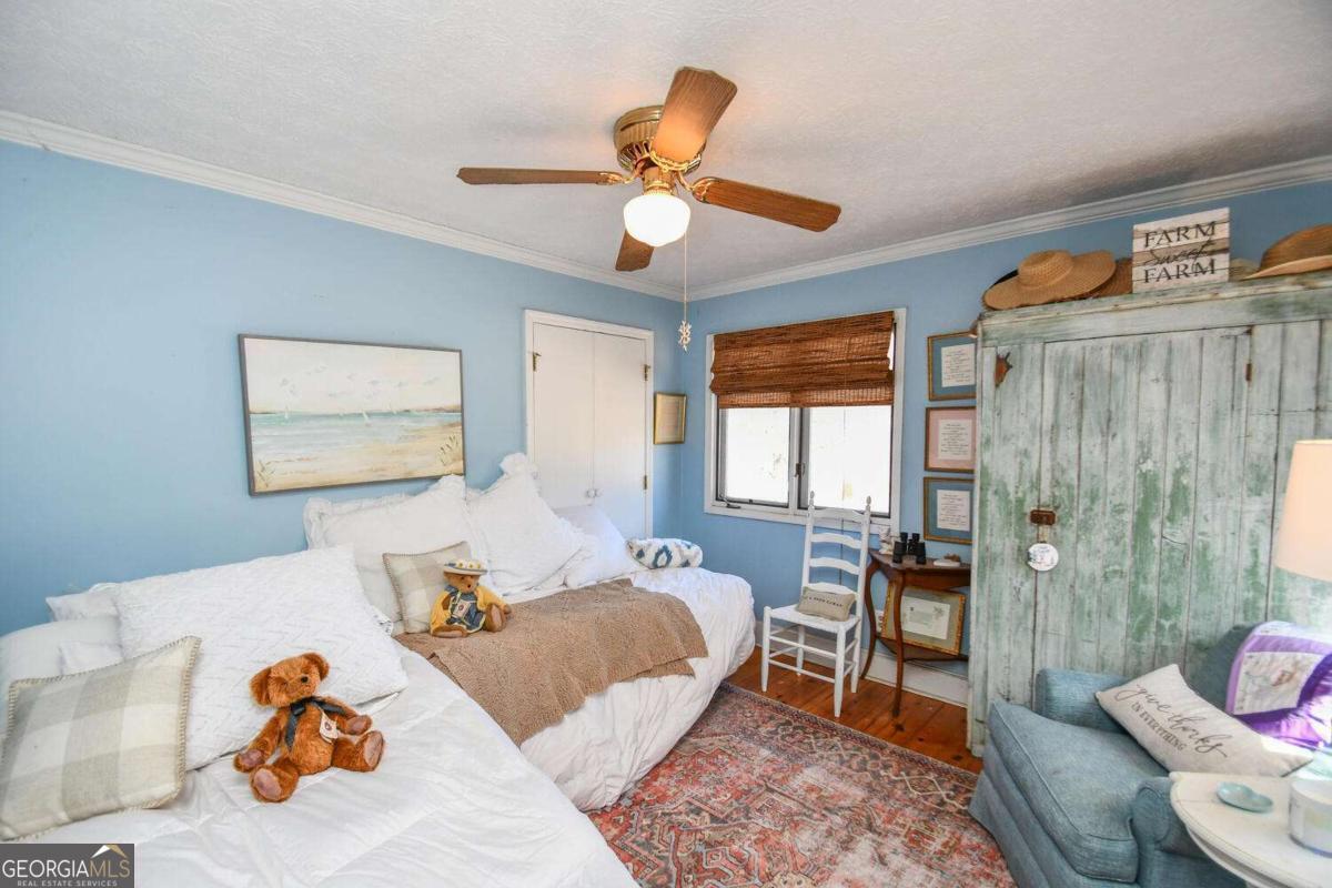 708 Hub Tatum Road Sautee Nacoochee, GA 30571 - Photo 91 of 100 a bedroom with furniture and a large window