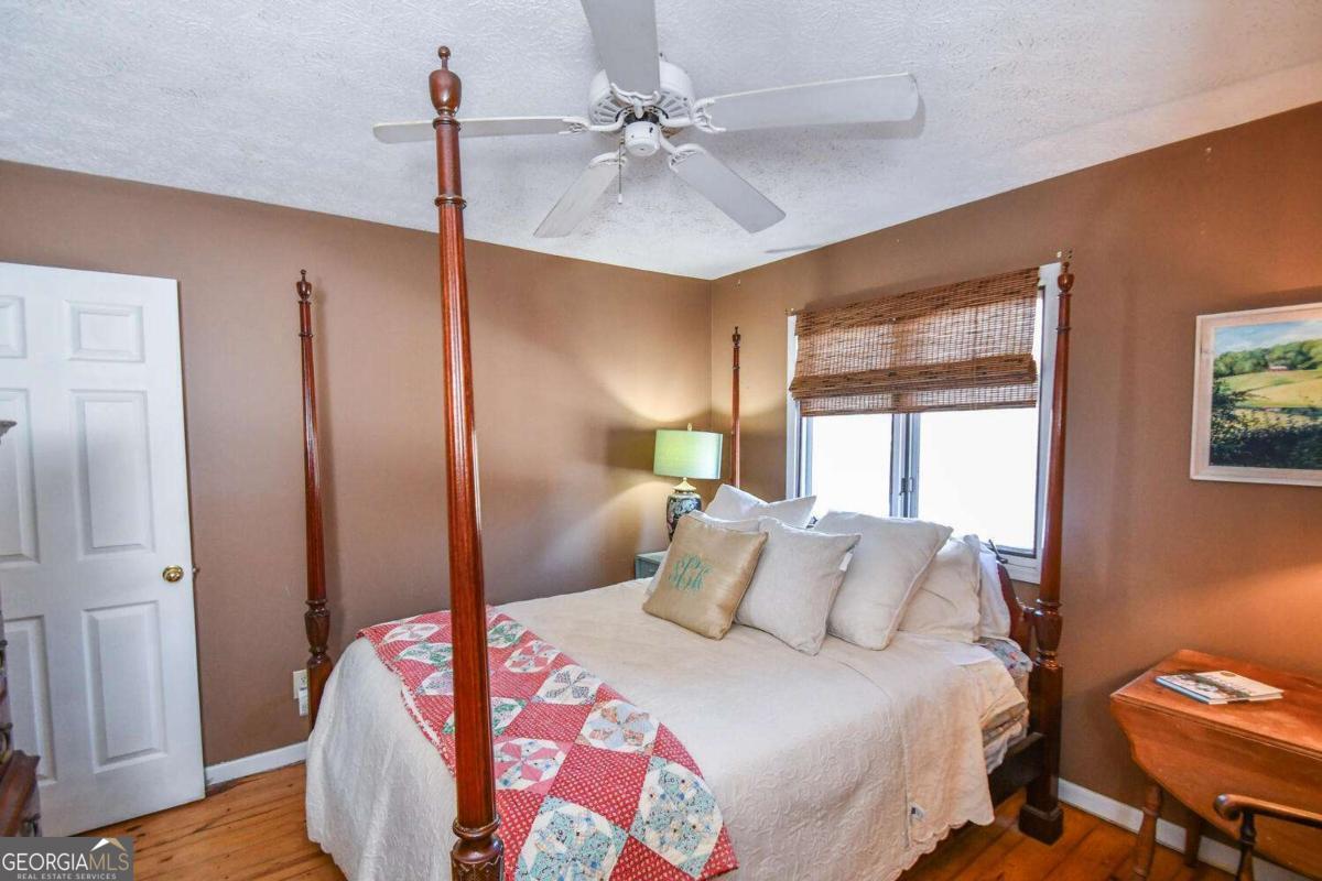 708 Hub Tatum Road Sautee Nacoochee, GA 30571 - Photo 95 of 100 a bedroom with a bed and a table